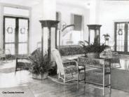 Interior view of Keystone Inn, lounge area, various sitting areas decorated with plants