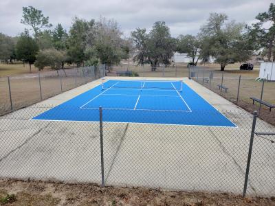 Pickleball Court, Blue Versa Court Tiles over existing slab with white lines & net